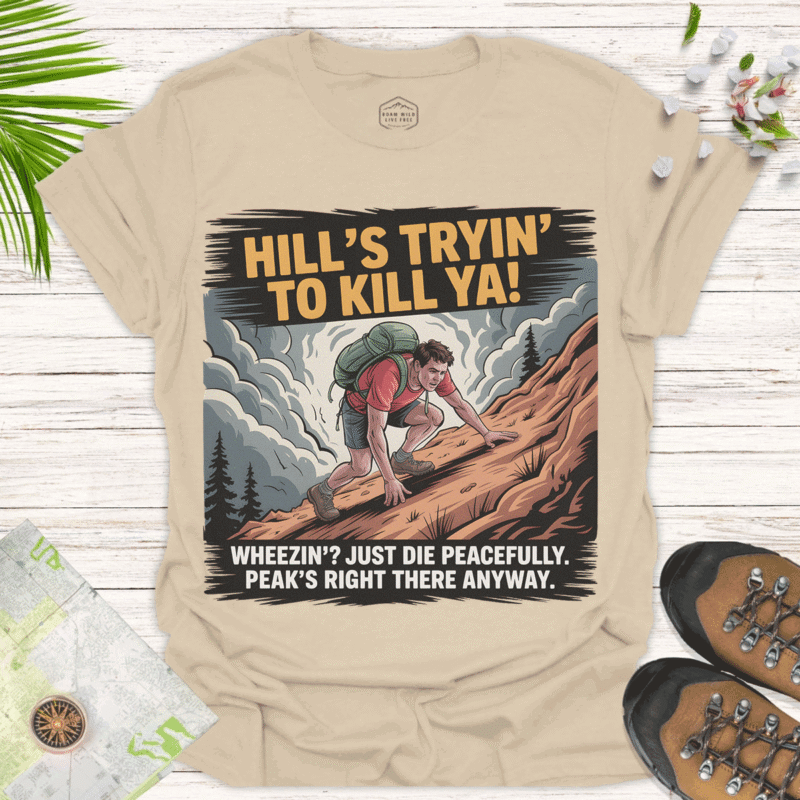 Hill’s Tryin’ to Kill Ya! — Funny Adventure Tee - sand